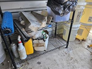 lot 34 image: Cleaning supplies and roller brush (on two shelves)