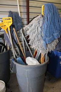 lot 96 image: Round Trash Bin with mops, handles and contents