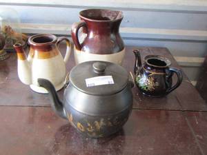lot 81 image: black handled pot with lid- brown handled pottery