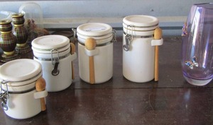 lot 82 image: set of 4 white canisters with scoops, purple vase