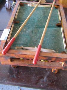 lot 87 image: mini wooden pool table with sticks and pool balls