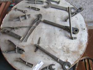 lot 111 image: ART PIECE WITH SEVERAL TOOLS  ATTACHED