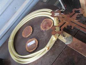 lot 175 image: White roping lasso , CINCH leather strap, METAL CROSS,, WOOD SLICE COASTERS