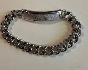 lot 244 image: STERLING - I D BRACELET -STERLING SILVER SHIELD  W STAILESS CHAIN - ENGRAVED GENE