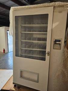 lot 4 image: BRAND NEW VENDING MACHINE XT0927T581 STILL IN SHIPPING CRATE READY TO BE SET UP AND PUT TO WORK. THIS UNIT IS VERY HEAVY. ONE WAS OPENED TO TAKE THE PICTURES BUT STILL IN CRATE. SAME PICTURES USED FOR ALL FIVE LOTS. SEE FULL DESCRIPTION