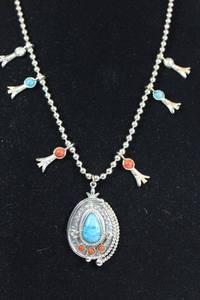 lot 1 image: Signed ART (Arthur Pepper, 1940s - 1970s) silver bead on metal chain faux Turquoise squash blossom style necklace. Designed by Arthur Pepper. Marked ART on back of pendant. Fold over clasp. 24L