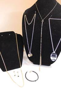 lot 33 image: Leather bracelet, Lofty Outlet Y-style necklace, Liz C. disc pendant necklace, Sarah Cov. Gold chain, and Weight Watchers necklace, see descriptions.