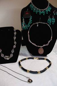 lot 36 image: Paparazzi blue green jewelry set, Disc pendant necklace, Omega choker necklace with acrylic butterfly, black acrylic bar necklace, and love knot style necklace, See descriptions.