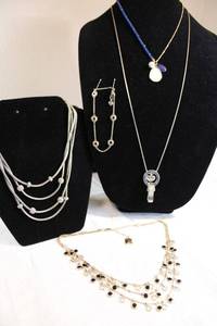 lot 38 image: Multi strand and single strand necklaces by Anne Klein, Juicy Couture, Brighton and Market&Spruce, plus Brighton bracelet.
