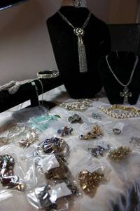lot 125 image: Decent jewelry that needs repair. May need O-ring, glue, missing stones, etc. Generous quantity.