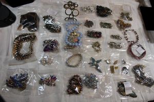 lot 130 image: Decent jewelry that needs repair. May need O-ring, glue, missing stones, etc. Generous quantity.