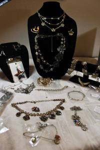 lot 124 image: Decent jewelry that needs repair. May need O-ring, glue, missing stones, etc. Generous quantity.
