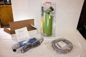 lot 181 image: Unused Oscillating Multi-tool, 12ft. Braided icemaker water connector universal, 25ft. Auto-recoil hose and nozzle