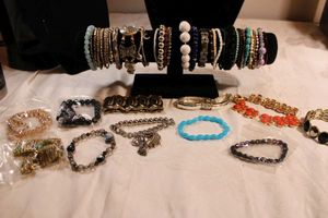 lot 88 image: (40) stretch bracelets. Varying styles, ages, materials, conditions.