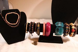 lot 76 image: (12) Wood bead bracelets. Varying styles and colors