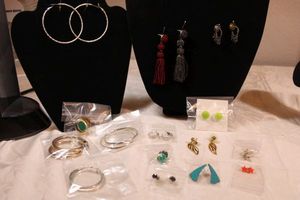lot 63 image: (12) Matched poststud earrings. Varying styles, ages, materials.