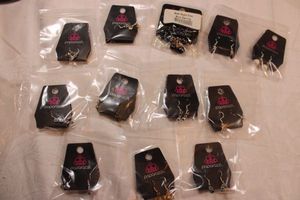 lot 53 image: (12) Paparazzi ear wire earrings on branded cards (12 count). Hang cards are intact