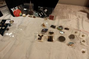 lot 104 image: Lapel Pins and pinback buttons.