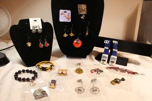 lot 99 image: Sports themed jewelry selection