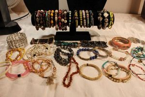 lot 96 image: Large selection of stretch bracelets. Generous selection. Varying styles and materials.