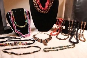 lot 75 image: (12) Wood bead necklaces. Varying styles and sizes.