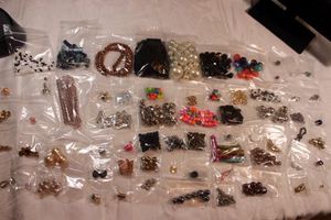 lot 90 image: (60) Beads. Varying materials, sizes and quantity. Includes glass, pearls and more.