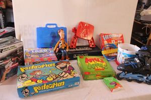 lot 270 image: Board games, Kids roller blades (size 5-8), VR goggles, and Woody doll