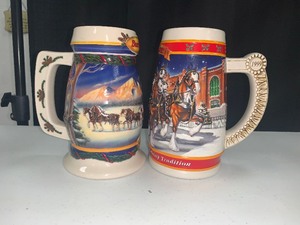 lot 46 image: Pair of Budweiser Holiday Steins These are stunningly created