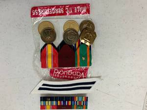 lot 136 image: Military metals pins and more