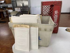 lot 144 image: plastic mail bin with generous amount of mailers and large carnation crate See Pics