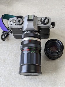 lot 234 image: Minolta XG-A 35mm Film Camera w Soligor f3.5 55-135mm Lens & 50mm f2 Lens