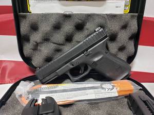 lot 1402 image: NEW  Glock 44 Compact 22LR Pistol w 2 Magazines, Extra Grips & Case