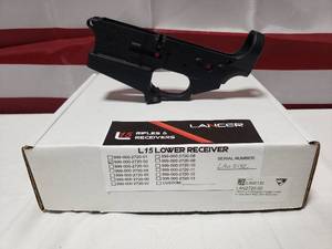 lot 1353 image: NEW Lancer L15 Stripped Forged Lower Receiver w Standard Mag Well Extension