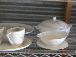 lot 84 image: Embassy China- cream sugar- platter- gravy boat- a covered casserole