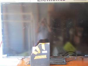 lot 3 image: 65 Sharp TV with remote and paperwork in very good condition picture is amazing