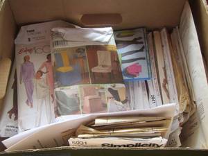 lot 144 image: Box of womens Simplicity and McCalls patterns