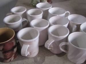 lot 165 image: Coffee cups- including  1 John Wayne  and oil dcor canister , plus