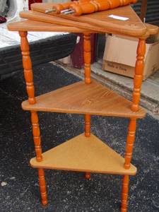 lot 204 image: 5 tier wooden shelf approx. 5 ft. tall goes in corner needs to be put together