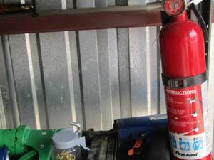 lot 58 image: caulking guns- fire extinguisher , garden tools plus
