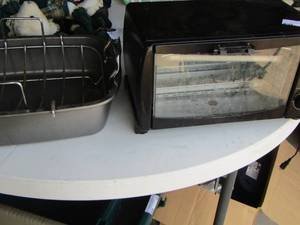 lot 84 image: Rival Convectional Oven and a deep oven roaster with rack insert
