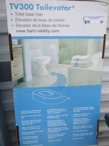 lot 30 image: TV300 Toilevator lift seat NIB