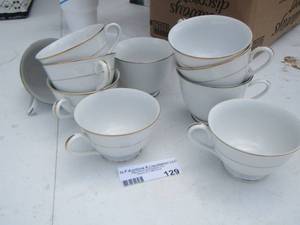 lot 129 image: Style house handled tea cups very cute
