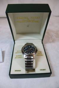 lot 112 image: Timber Creek by Wrangler Eversteel watch in case. Model K402