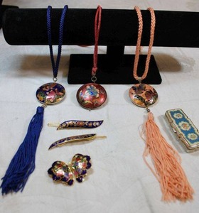lot 16 image: Cloisonne jewelry. Includes necklaces, pill box, berets, and more