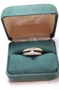 lot 103 image: 10K yellow gold and diamond vintage wedding set (2 pcs). Both pieces marked 10K. Size 9.75 (band) and 9.25 (wedding ring).