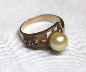lot 102 image: 14K yellow gold Pearl and Ruby by pass ring. Marked 14K. Size 6.5