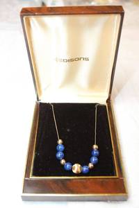 lot 105 image: 14K yellow gold Lapis Lazuli bead necklace with push button butterfly clasp. Marked 14K. 16L