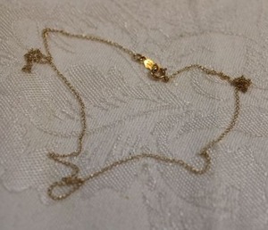 lot 106 image: 10K yellow gold necklace. Marked 10K AJC. 14.5L