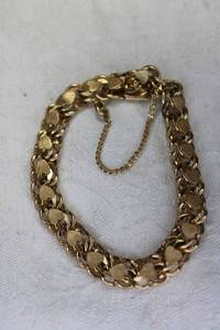 lot 95 image: 12K Gold Filled bracelet with hearts and safety chain. Marked 12K Gold Filled