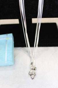 lot 81 image: Sterling Silver HEAVY multi strand lariat style necklace with heart end caps. Marked 925. Lobster clasp. With storage pouch and gift box